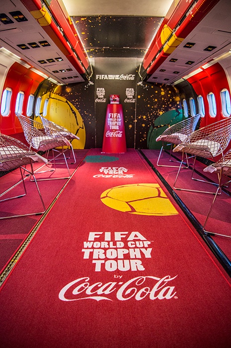Transportation plane with FIFA world cup and Coca Cola carpet